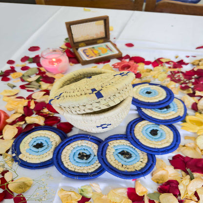 EVIL - EYE Handcrafted Jute Coasters With Sabai Grass Basket (SET OF 6 COASTERS + 1 BASKET)