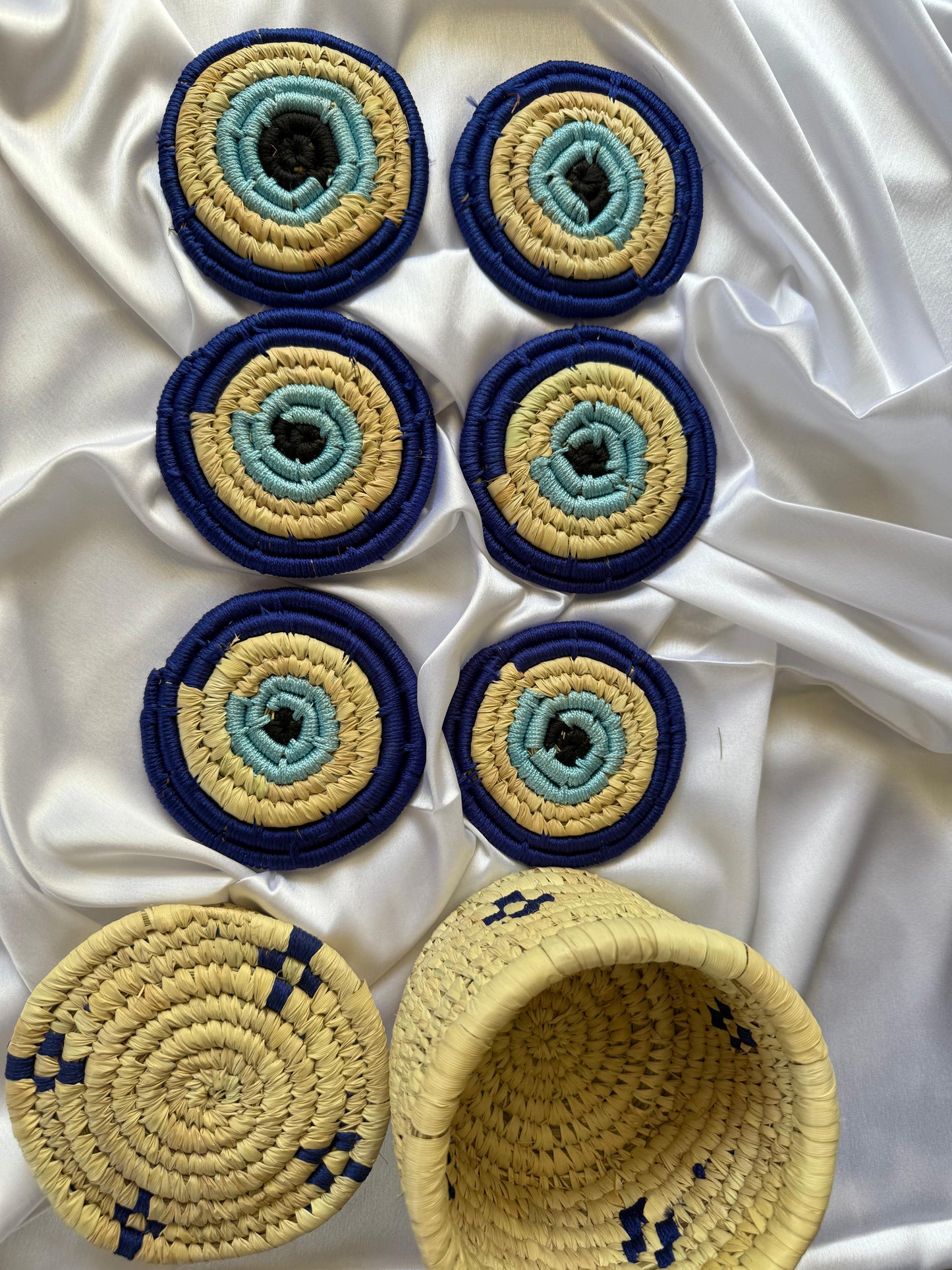 EVIL - EYE Handcrafted Jute Coasters With Sabai Grass Basket (SET OF 6 COASTERS + 1 BASKET)
