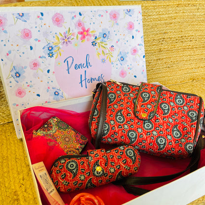 The Scarlet Bloom Hamper- Handblock Printed Red Sling with Matching Goggle Case, Wallet & Free Scented Candle